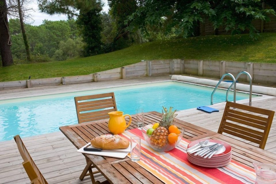 Sit out by the private pool and enjoy the sunshine.
