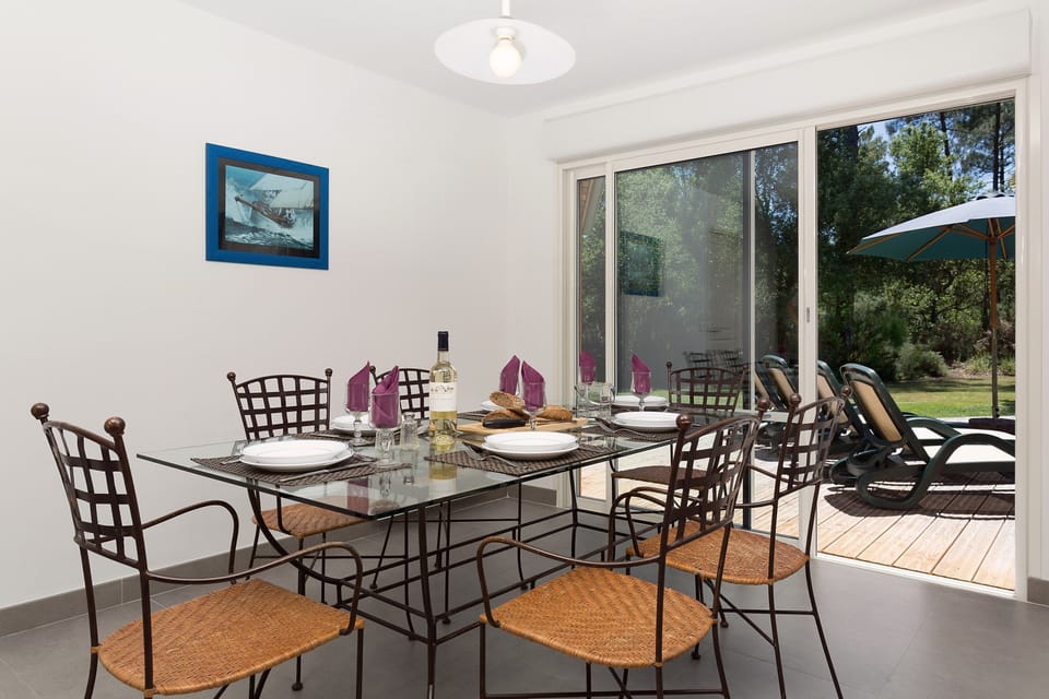 Enjoy your food at the grand dining table with seating.