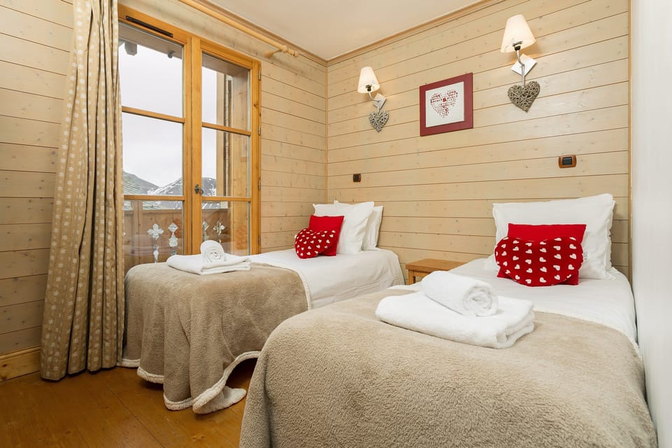 There are 2 Single beds in the bedroom.
