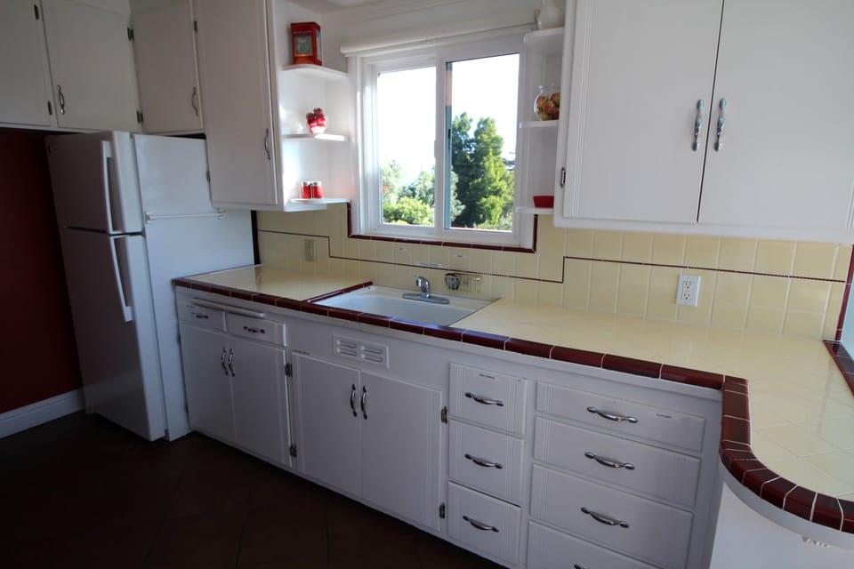 Kitchen with a distant view of the San Francisco Bay where container ships wait