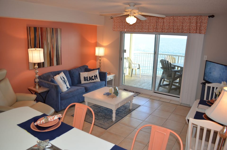 Living area w/ Queen Sleeper Sofa, Flat Screen TV &  one stunning view!