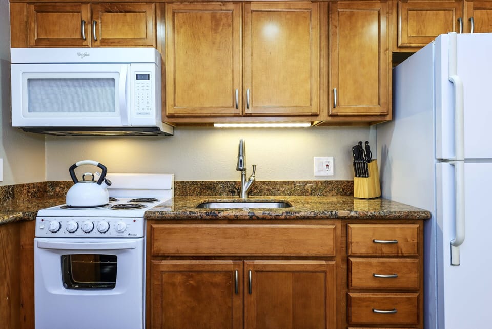 kitchen with stove, oven and microwave