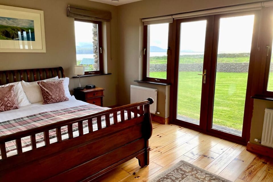 Master Bedroom with Ocean Views and Doors that Open to Backyard