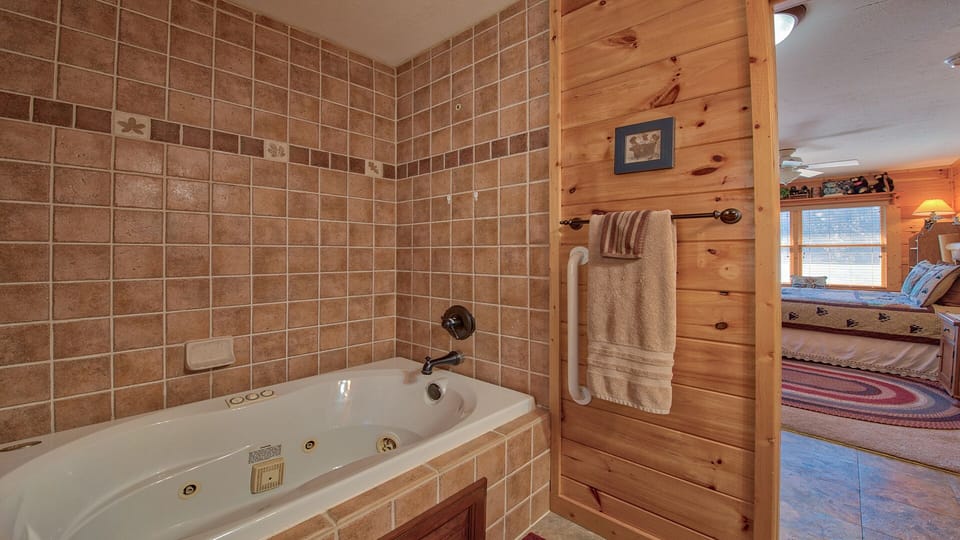 One of 2 upstairs baths. Wonderful, large jetted tub to relax in. 