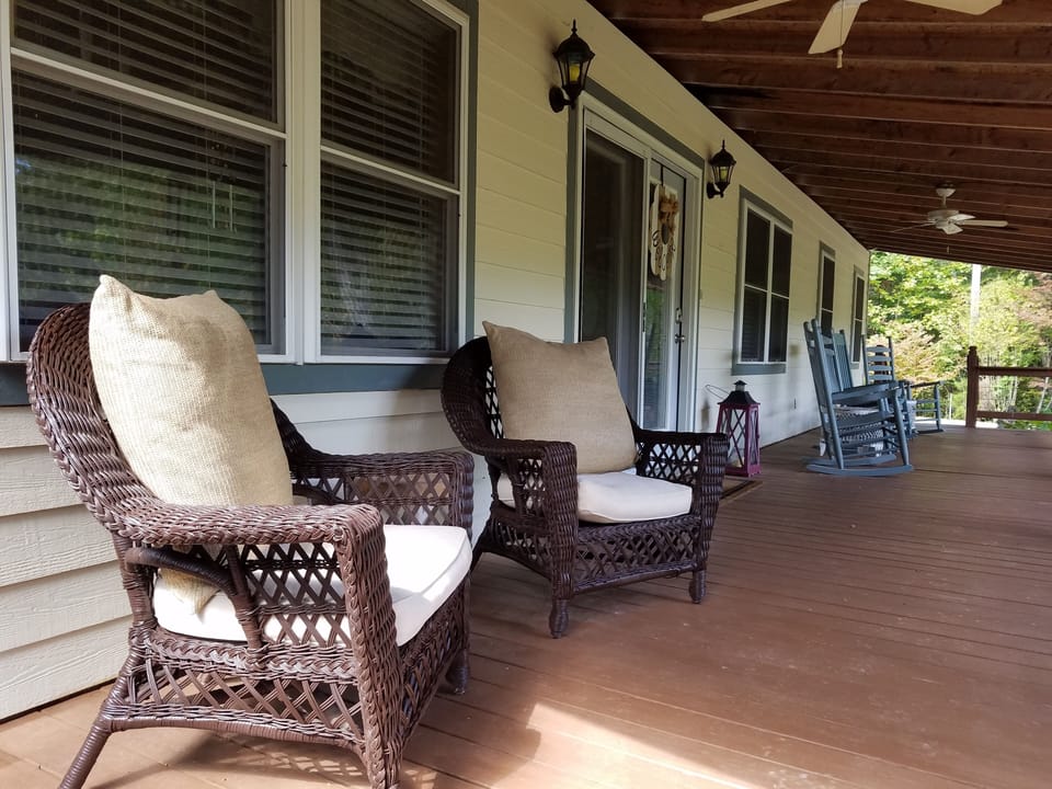Plenty of front porch seating with mountain view.