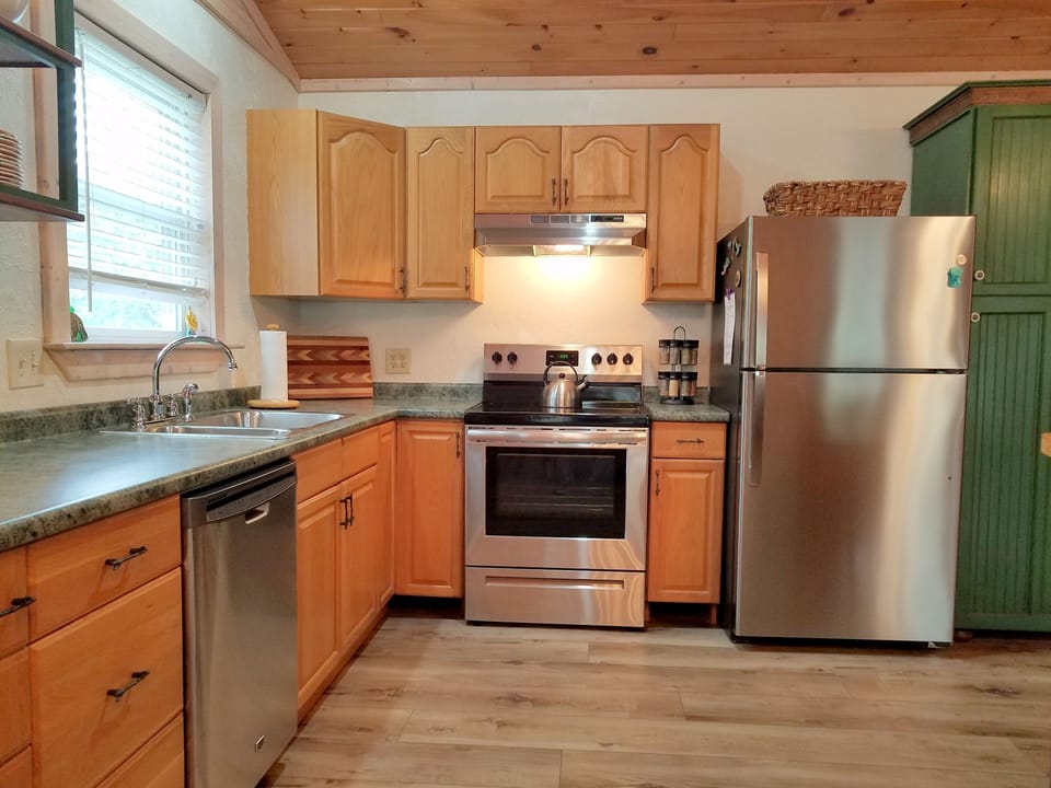 Fully stocked kitchen with new appliances.