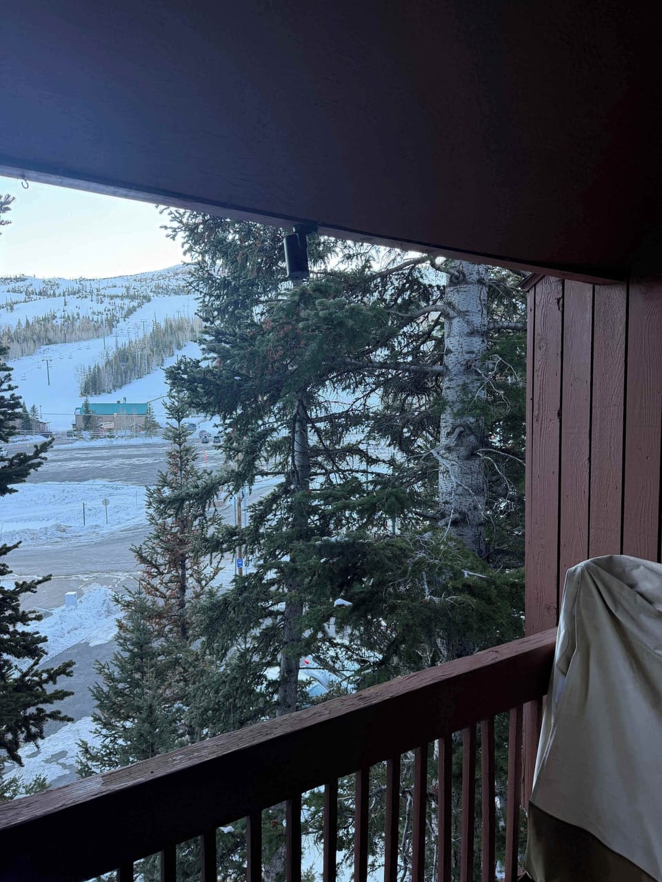 Camera on balcony facing mountains.
