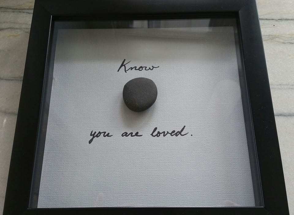 Feel the love!  This is hanging in the Master bedroom w/stone from Harbert Beach