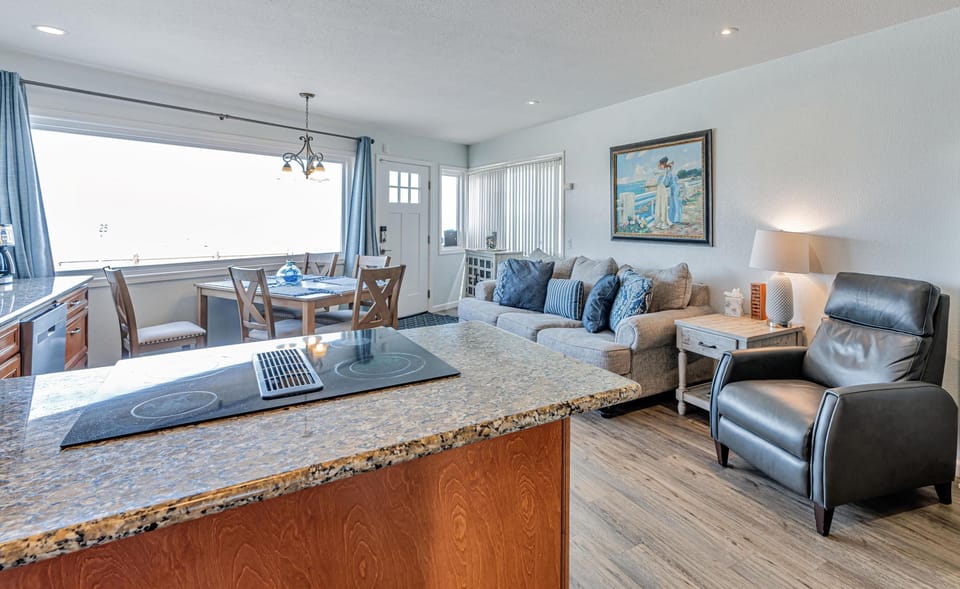 Looking back to front door. Kitchen, dining and family room.