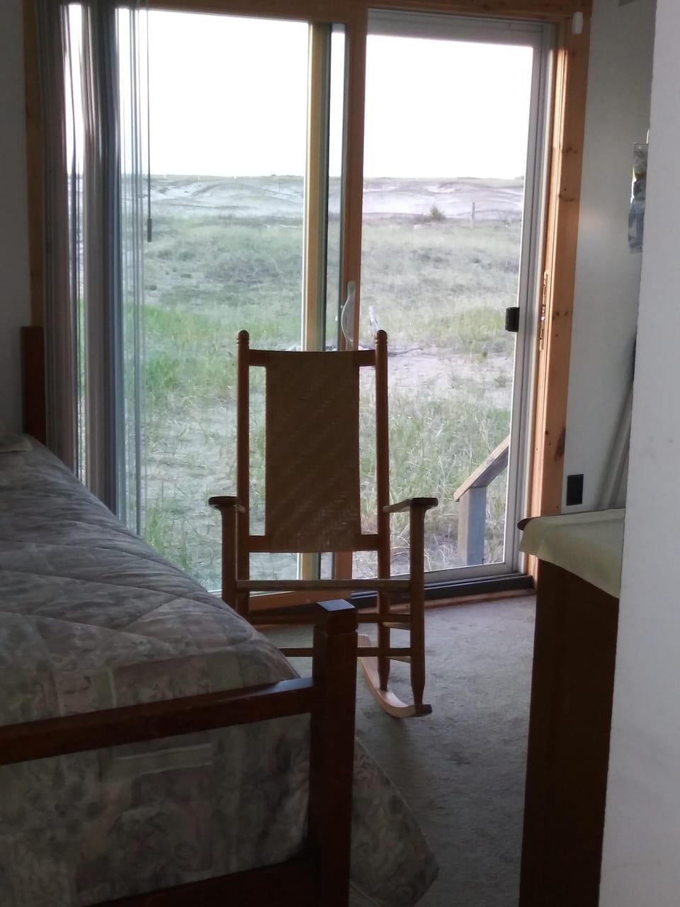 View from the guest room of the sandy beach in back