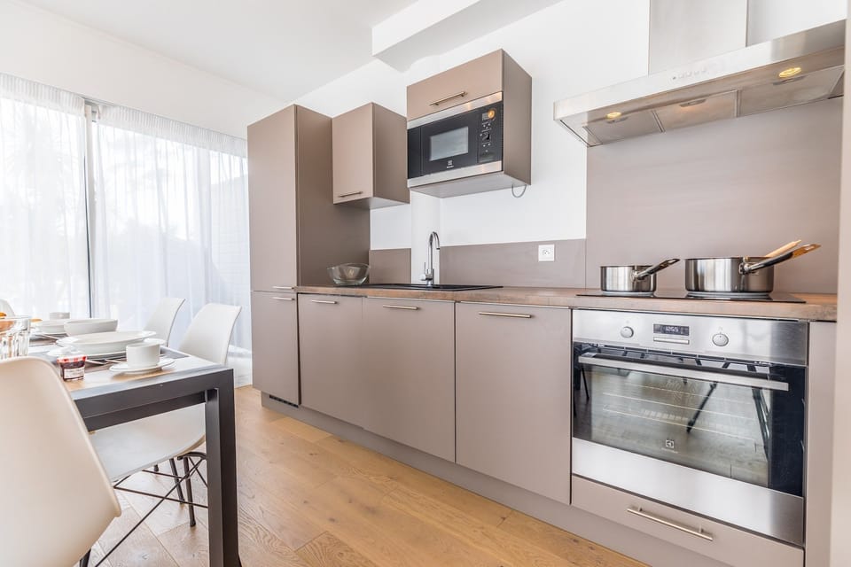 Prepare meals in the kitchenette and enjoy them at the dining table.