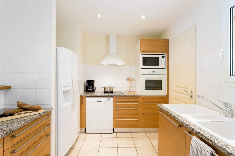 Curb your appetite by cooking a meal in your kitchen.
