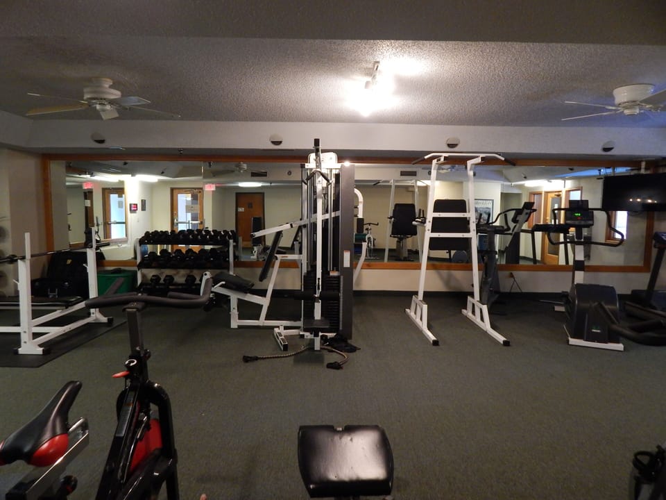 Stay in shape during your getaway with this well-equipped fitness center featuring weights, cardio machines, and strength training equipment.