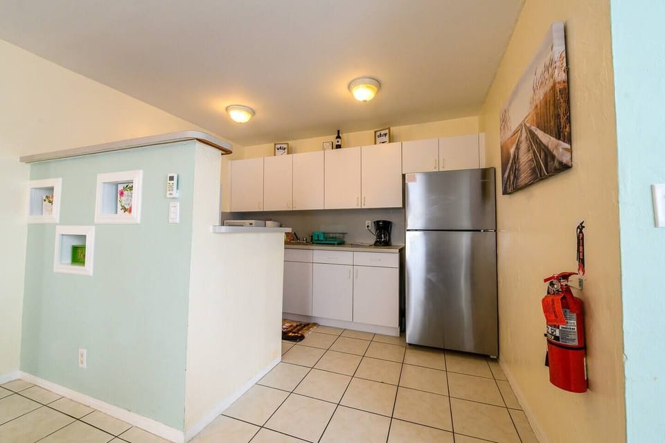 The kitchen is equipped for real cooking with Calphalon non-stick pans and real knives.