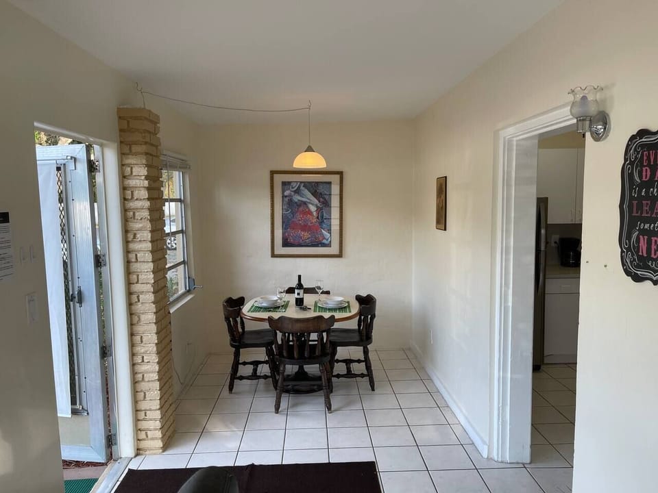 The other side of the front room, with the front door on the left and the door to the living/kitchen on the right.