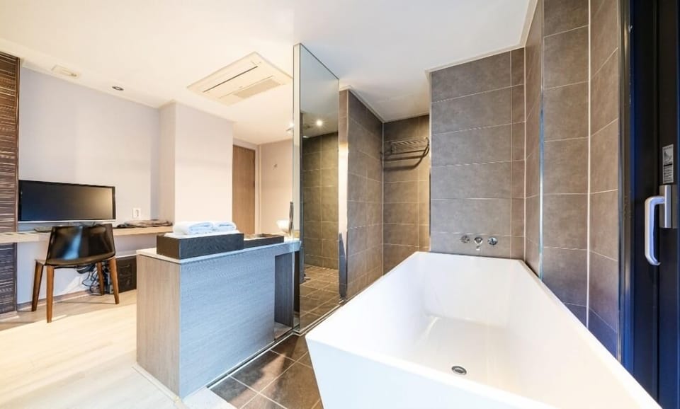 Suite Room - Terrace | Bathroom | Hair dryer, bathrobes, towels, shampoo