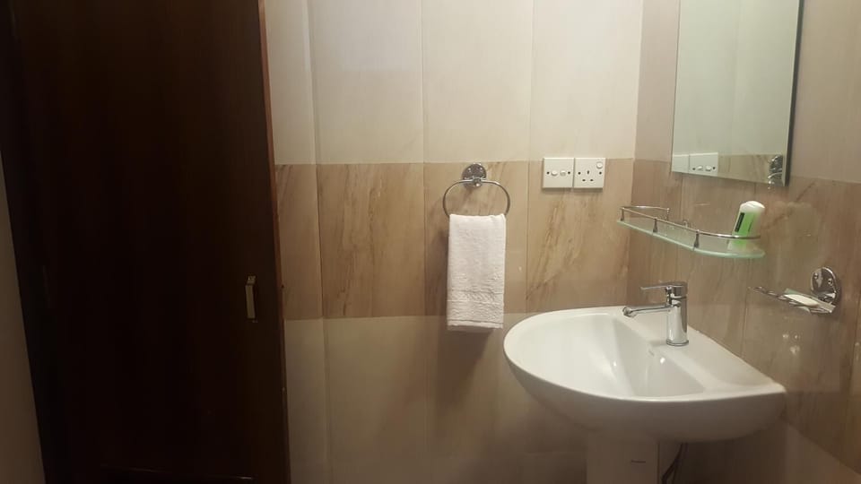 Shower, free toiletries, slippers, towels