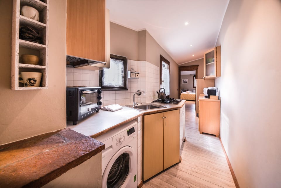 Apartment, 2 Bedrooms | Private kitchenette | Full-size fridge, stovetop, cookware/dishes/utensils