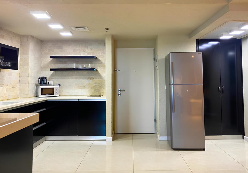 Exclusive Studio Suite, 1 Bedroom, Hot Tub, Beach View | Private kitchen | Mini-fridge, stovetop, coffee/tea maker, electric kettle