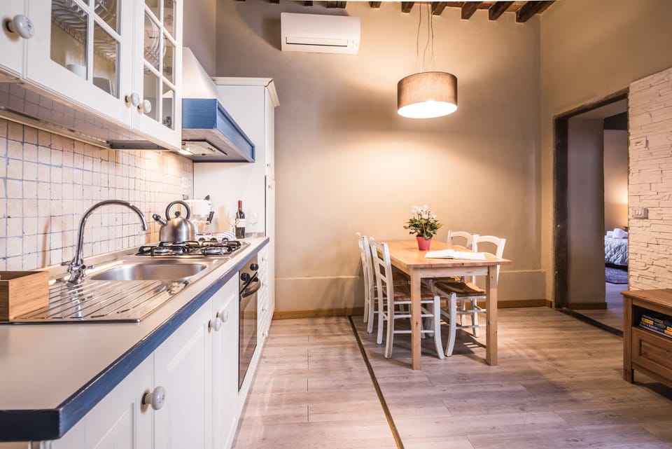 Apartment, 2 Bedrooms | Private kitchen | Full-size fridge, stovetop, cookware/dishes/utensils