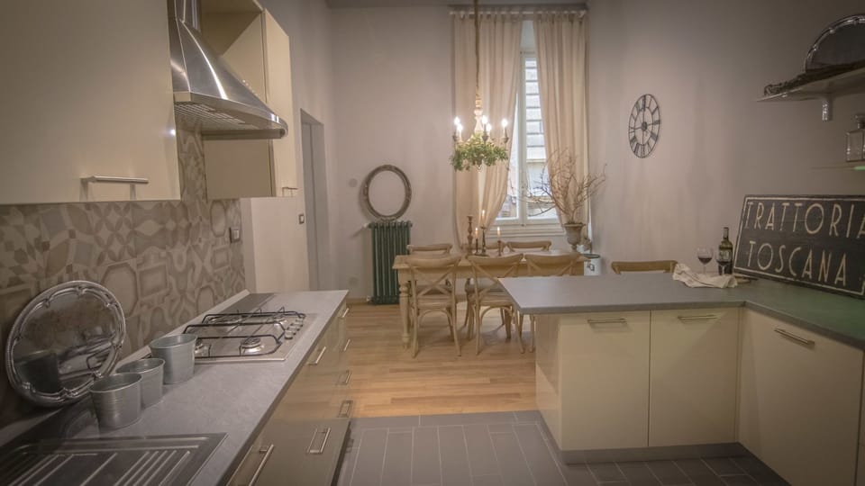 Apartment, 4 Bedrooms | Private kitchen | Full-size fridge, stovetop, highchair, cookware/dishes/utensils