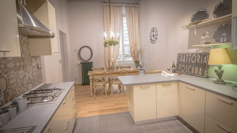 Apartment, 4 Bedrooms | Private kitchen | Full-size fridge, stovetop, highchair, cookware/dishes/utensils