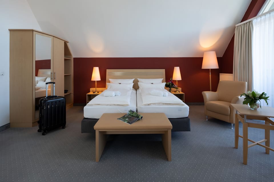 Junior Suite, City View | Premium bedding, in-room safe, individually decorated