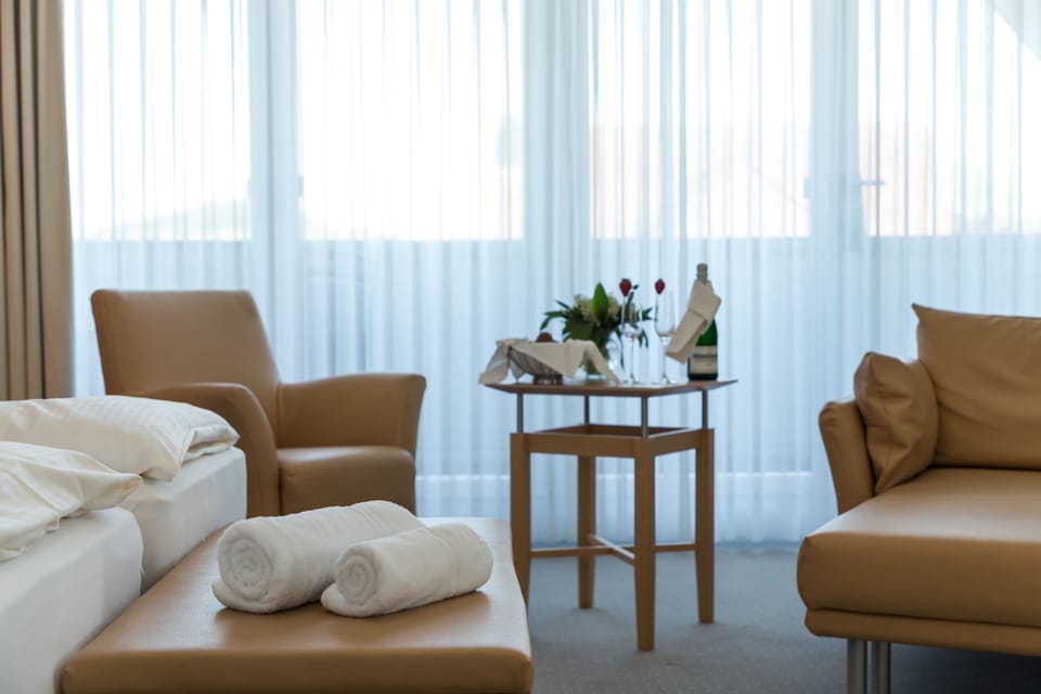 Junior Suite, City View | Premium bedding, in-room safe, individually decorated