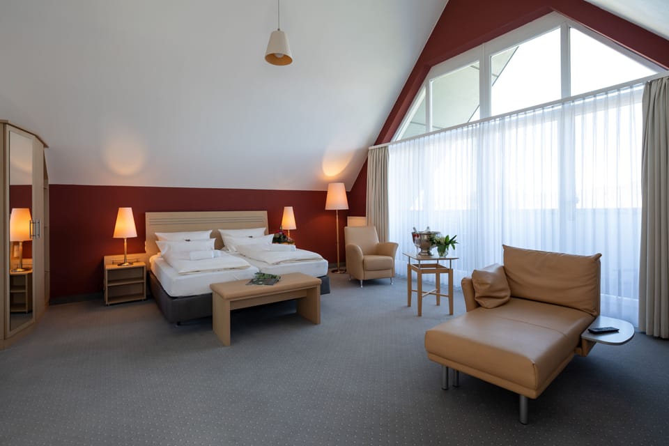 Junior Suite, City View | Premium bedding, in-room safe, individually decorated