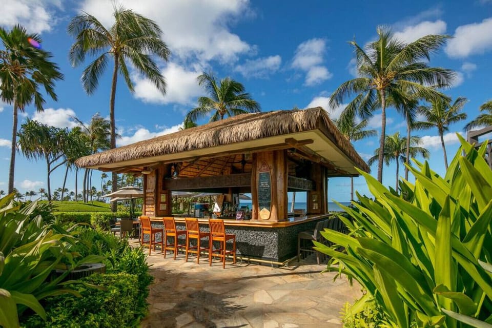 Bar by the front pool with drinks and food options