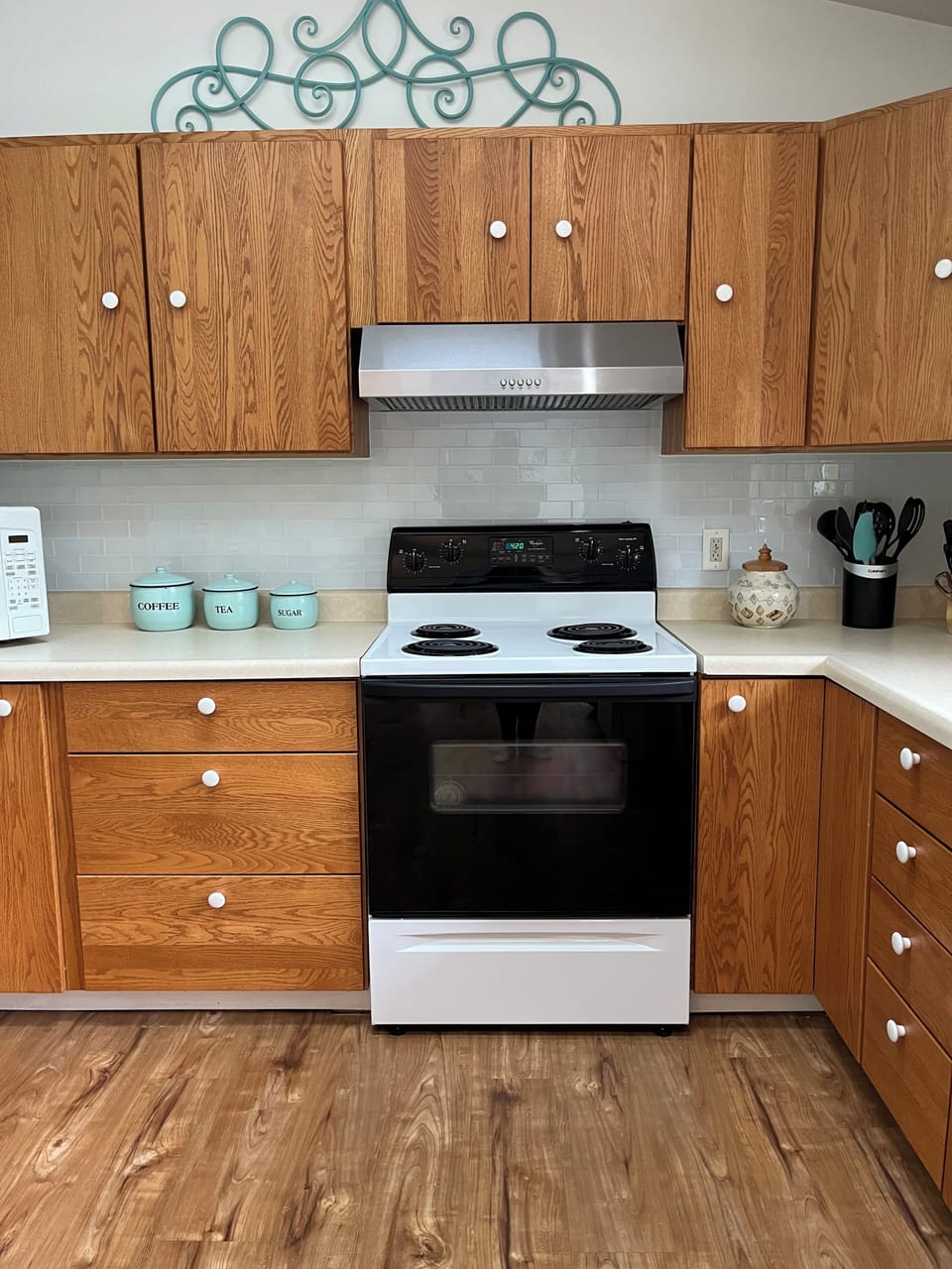 The kitchen is very well stocked with cookware and diningware.