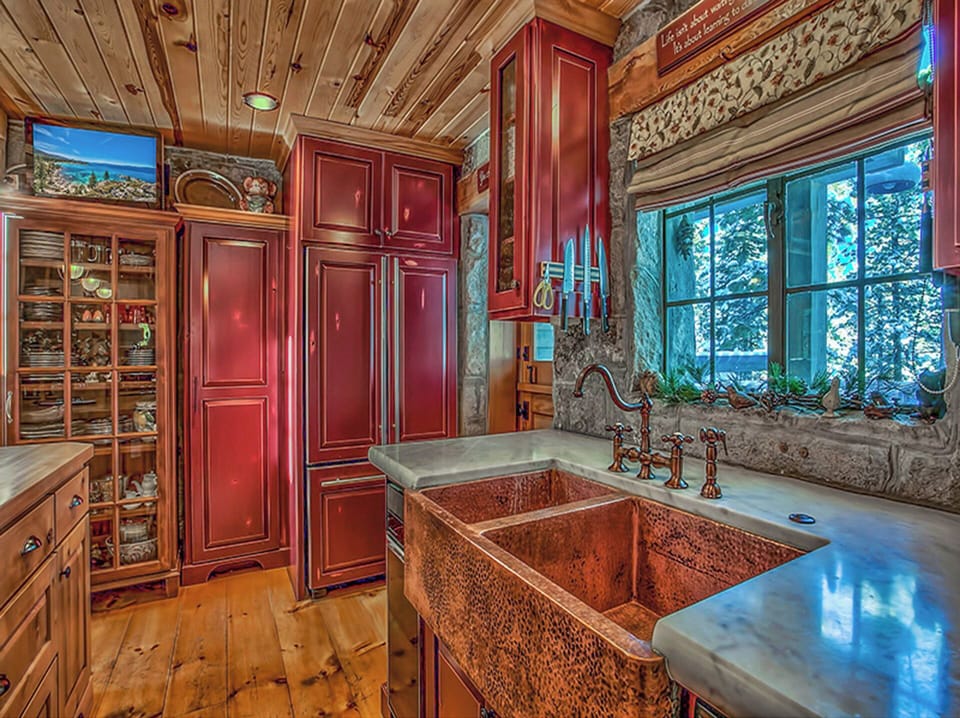 Kitchen and refrigerator. One of three TVs