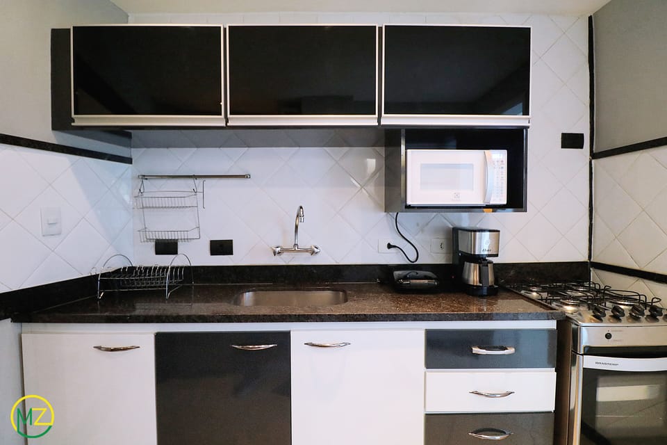 Penthouse, Multiple Beds, Non Smoking | Private kitchen | Full-size fridge, microwave, oven, stovetop