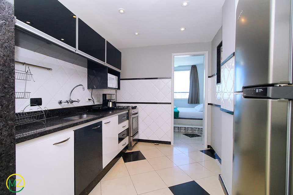 Penthouse, Multiple Beds, Non Smoking | Private kitchen | Full-size fridge, microwave, oven, stovetop