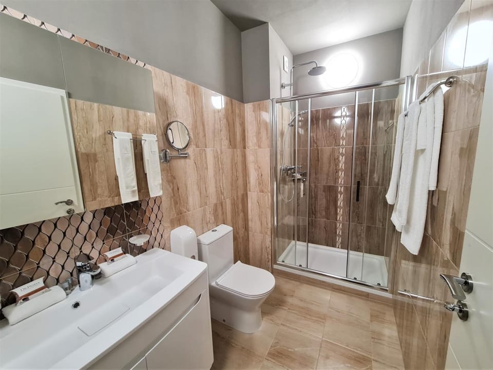 Shower, rainfall showerhead, towels