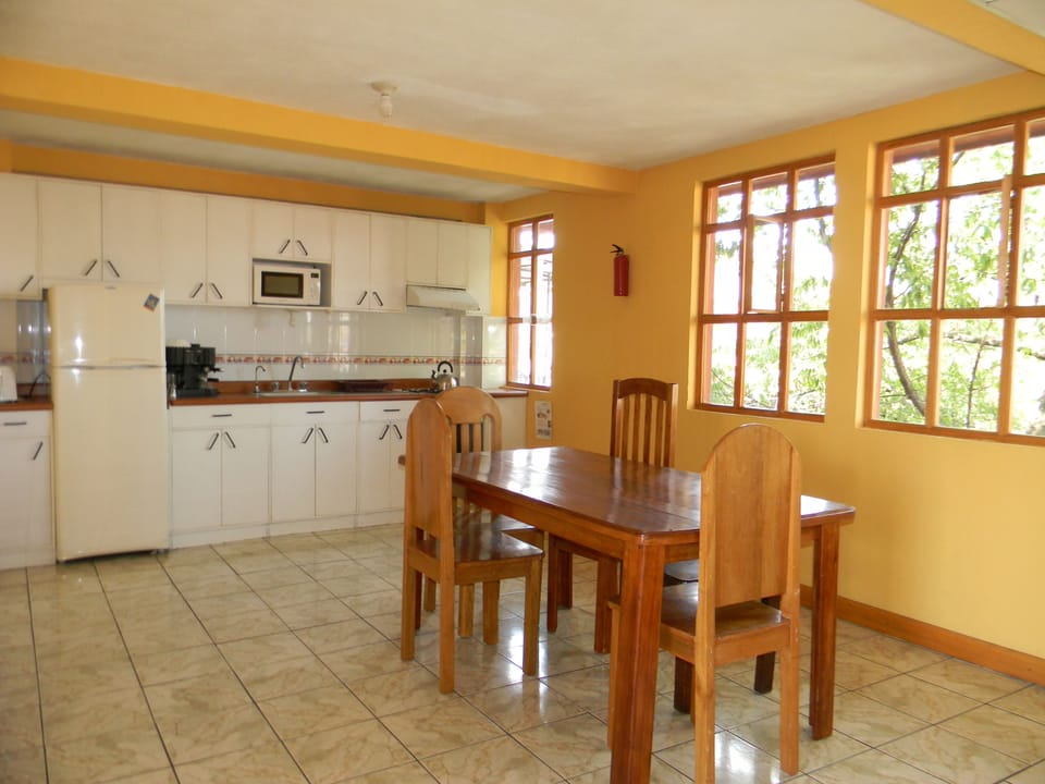 Apartment, Multiple Beds, Non Smoking | Private kitchen | Coffee/tea maker, full-size fridge, microwave, oven