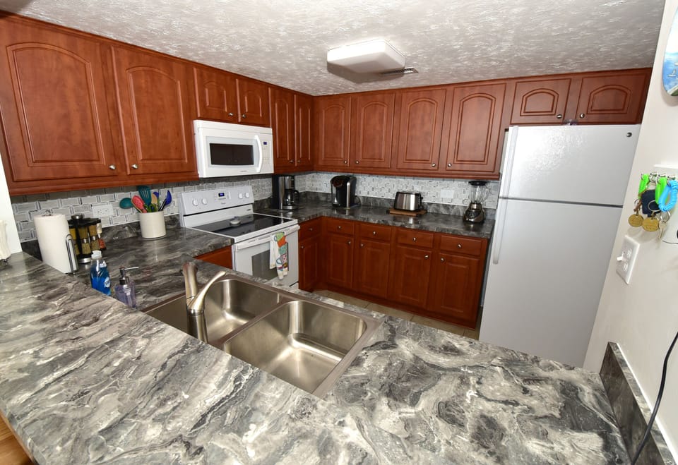 Enjoy Our Kitchen With Its Ocean Views & Updated Appliances/Supplies Like Home.
