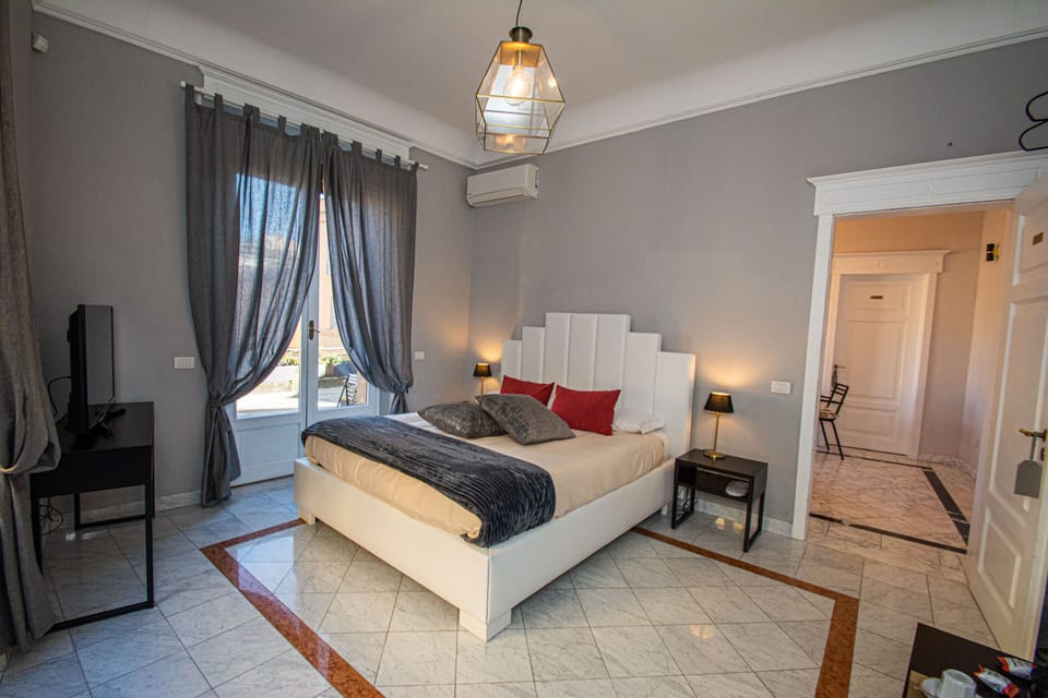 Deluxe Double Room | Desk, blackout drapes, iron/ironing board, cribs/infant beds