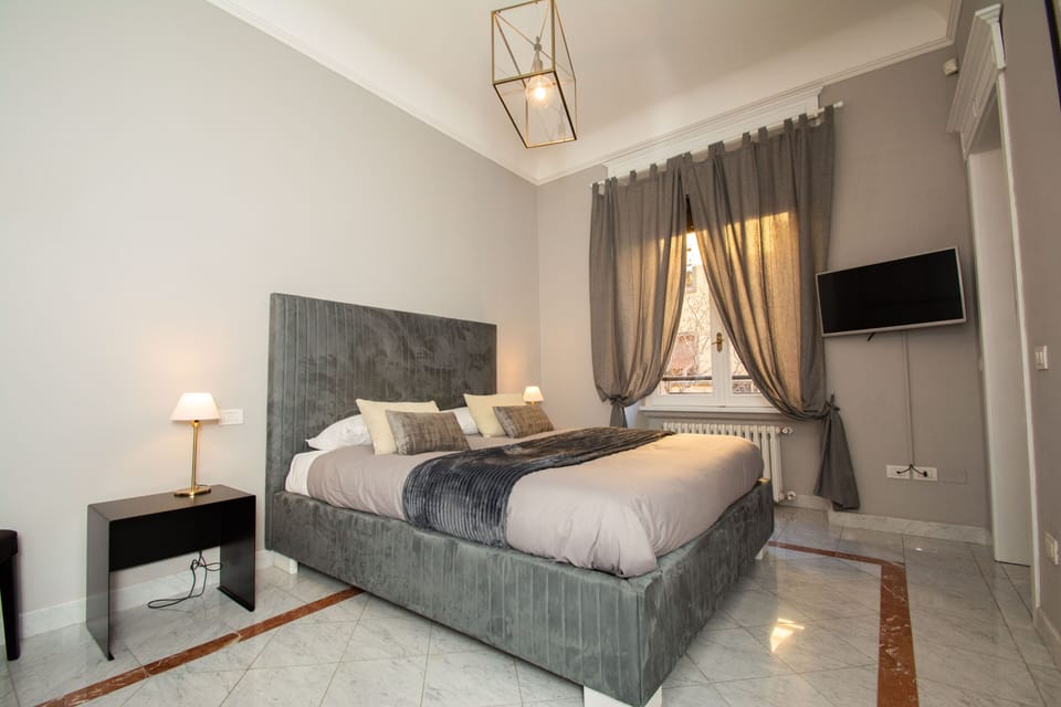 Deluxe Double Room | Desk, blackout drapes, iron/ironing board, cribs/infant beds