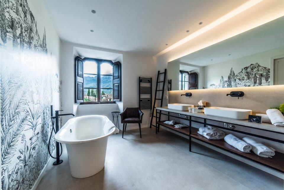 Luxury Suite, 1 King Bed | Bathroom | Rainfall showerhead, designer toiletries, hair dryer, bathrobes