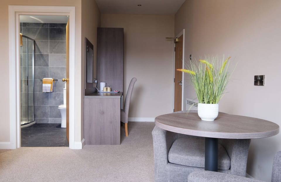 Select Comfort beds, desk, laptop workspace, iron/ironing board