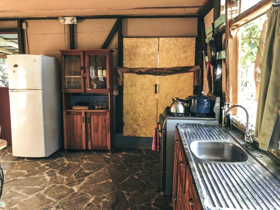 Fully equipped kitchen with custom slate flooring