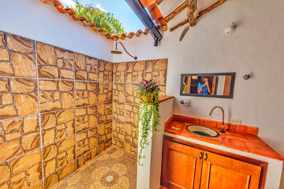 Shower, rainfall showerhead, designer toiletries, towels