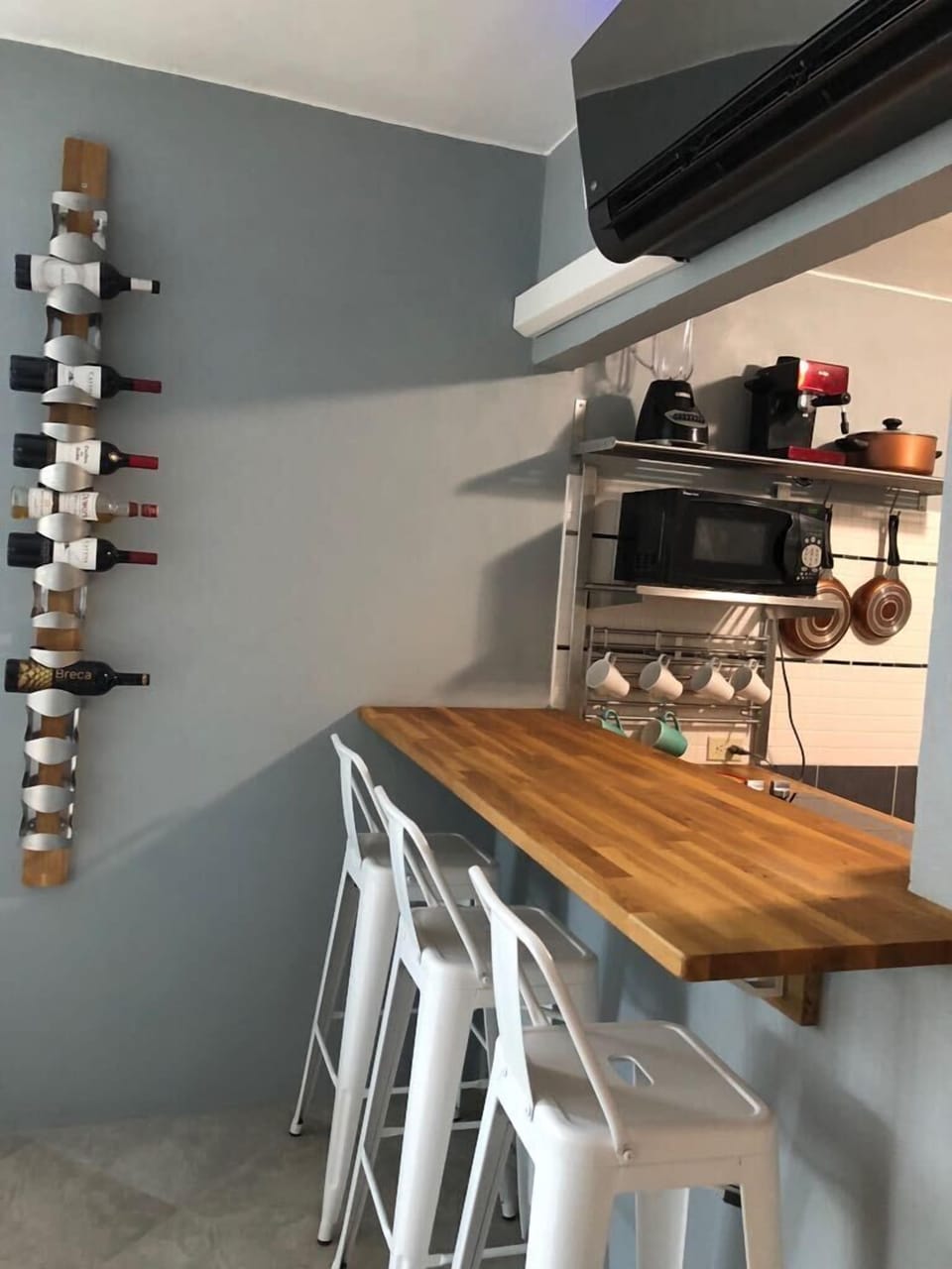 Breakfast counter seats three. Stainless steel appliances. 