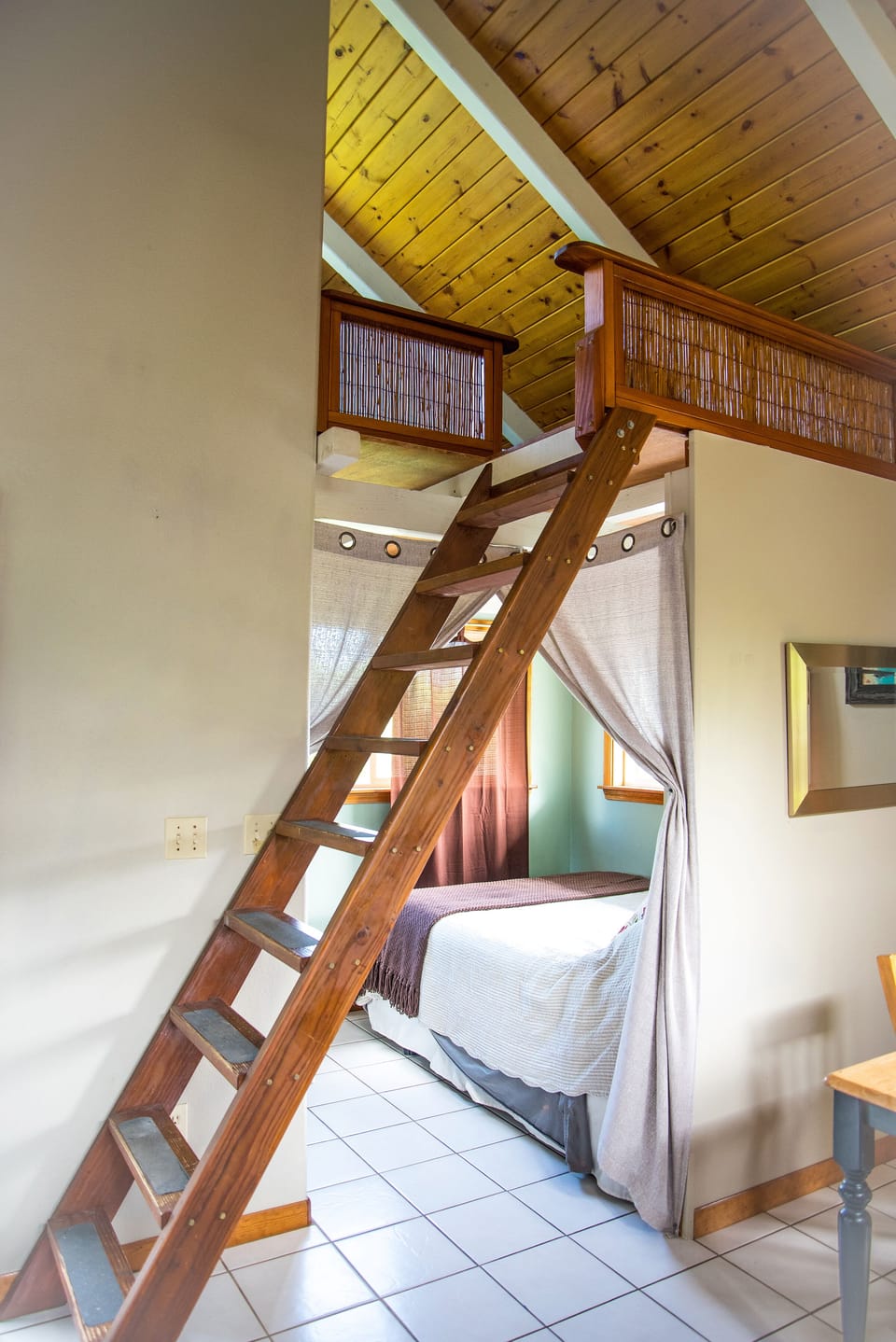 stairs to loft, and bed downstairs
