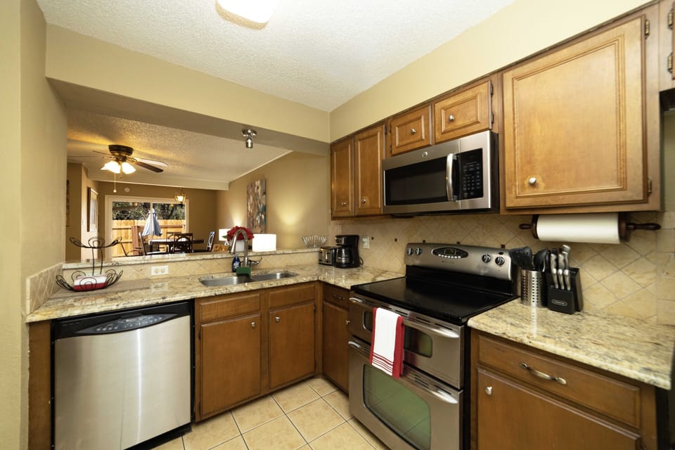 Kitchen with double oven, dishwasher, microwave, coffee maker (drip), toaster