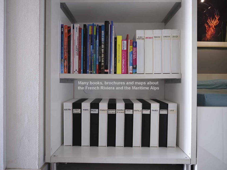 The bookcase has two shelves entirely dedicated to the French Riviera.