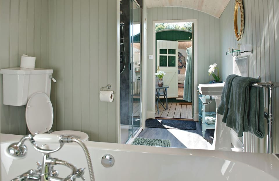 The bathing and dressing hut with double ended bath and walk in shower