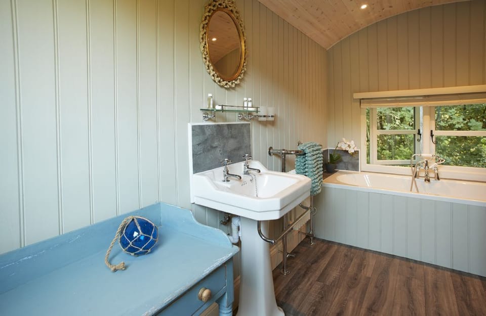 The bathing and dressing hut with double ended bath and walk in shower