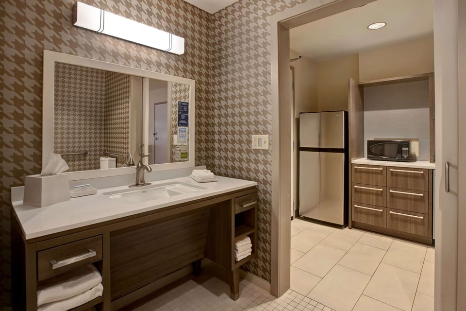 Shower, designer toiletries, towels